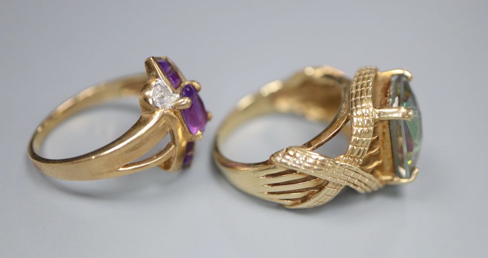 A 9ct gold and tourmaline? dress ring with fancy mount and a 9ct gold, amethyst and diamond crossover ring, gross 10.7g